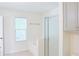 Bathroom with a tub and separate glass enclosed shower at 3761 Lake Point Blvd, Suwanee, GA 30024