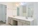 Bathroom features dual sinks, a tub, and a separate glass enclosed shower at 3761 Lake Point Blvd, Suwanee, GA 30024