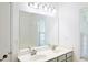 Bathroom featuring a double sink vanity with a large mirror and recessed lighting at 3761 Lake Point Blvd, Suwanee, GA 30024