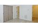 This bedroom features a stylish sliding closet and vinyl flooring at 3761 Lake Point Blvd, Suwanee, GA 30024