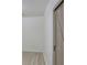 Bright bedroom featuring light wood floors, neutral walls, and sliding barn door at 3761 Lake Point Blvd, Suwanee, GA 30024