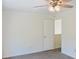 Bedroom featuring neutral walls, carpet flooring, tray ceiling, and ceiling fan at 3761 Lake Point Blvd, Suwanee, GA 30024