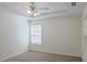 Cozy bedroom featuring neutral walls, carpet flooring, ceiling fan and bright window at 3761 Lake Point Blvd, Suwanee, GA 30024