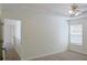 Cozy bedroom featuring neutral walls, carpet flooring, and a bright window at 3761 Lake Point Blvd, Suwanee, GA 30024
