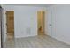 Bright bedroom featuring an en-suite bathroom and stairs, and light wood floors at 3761 Lake Point Blvd, Suwanee, GA 30024
