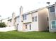 Private backyard with lush green grass and a patio, backing onto neighboring homes at 8838 Seneca Rd, Palmetto, GA 30268