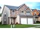 Charming two-story home with a stone facade and a two-car garage, set on a well-maintained lawn at 8838 Seneca Rd, Palmetto, GA 30268