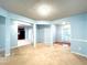 Bright living room with open layout, light blue walls, and seamless flow to other rooms at 8838 Seneca Rd, Palmetto, GA 30268