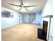 Cozy living room with fireplace, soft carpet, and open access to other rooms at 8838 Seneca Rd, Palmetto, GA 30268