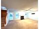 Spacious living room with a fireplace, a rear entrance and natural light at 8838 Seneca Rd, Palmetto, GA 30268