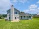 The back of the home with a lush lawn, large windows and a private backyard at 2226 Exchange Se Pl, Conyers, GA 30013