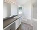 This bathroom features a large vanity, garden tub with tile surround, and a window at 2226 Exchange Se Pl, Conyers, GA 30013