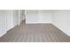 Large bedroom featuring neutral carpet, plenty of natural light, and ample space at 2226 Exchange Se Pl, Conyers, GA 30013