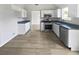 Updated kitchen with stainless steel appliances, stone countertops and ample storage at 2226 Exchange Se Pl, Conyers, GA 30013