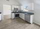Well-lit kitchen featuring stainless steel appliances, white cabinets, and modern countertops at 2226 Exchange Se Pl, Conyers, GA 30013