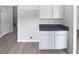 Bright kitchenette offering built-in cabinets, modern countertops, and ample storage space at 2226 Exchange Se Pl, Conyers, GA 30013