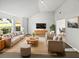 Bright, staged living room with vaulted ceilings, a neutral palette and large picture windows at 2226 Exchange Se Pl, Conyers, GA 30013