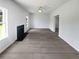 Spacious living room featuring a fireplace, ceiling fan, and neutral decor at 2226 Exchange Se Pl, Conyers, GA 30013
