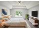 Staged main bedroom with tray ceilings, neutral palette, large windows and ensuite bath at 2226 Exchange Se Pl, Conyers, GA 30013