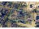 Aerial view of a vacant lot surrounded by mature trees in a desirable neighborhood, ready for new construction at 730 Ponderosa Ct, Fayetteville, GA 30214