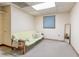 Basement features a futon, small window, and carpeted floors, perfect for relaxing at 730 Ponderosa Ct, Fayetteville, GA 30214