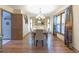 Formal dining room featuring a decorative chandelier and large window with natural light at 730 Ponderosa Ct, Fayetteville, GA 30214