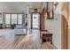 Bright entryway featuring hardwood floors, a bench, and an open view into the adjacent living area at 730 Ponderosa Ct, Fayetteville, GA 30214