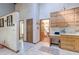 Spacious kitchen with tall ceilings and cabinets with entry view to dining room at 730 Ponderosa Ct, Fayetteville, GA 30214
