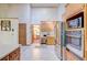 Open kitchen featuring stainless steel appliances, wood cabinets, and view to dining area at 730 Ponderosa Ct, Fayetteville, GA 30214