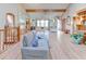 Spacious living room featuring vaulted ceilings, wood beams, hardwood floors, and ample natural light at 730 Ponderosa Ct, Fayetteville, GA 30214