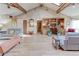 Expansive living room featuring hardwood floors, vaulted ceilings, built-in shelving, and comfortable seating at 730 Ponderosa Ct, Fayetteville, GA 30214