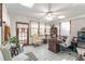 Bright office space with multiple windows, white tiled floors, and cozy seating at 730 Ponderosa Ct, Fayetteville, GA 30214