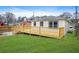 The backyard features a newly constructed wood deck overlooking the spacious, green lawn at 1 Lamar Ave Sw, Atlanta, GA 30310