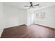 Bright bedroom featuring wood-look floors, a ceiling fan, and a large double door closet at 1 Lamar Ave Sw, Atlanta, GA 30310