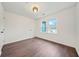 A cozy bedroom with luxury vinyl flooring, a ceiling light and a large bright window at 1 Lamar Ave Sw, Atlanta, GA 30310