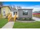 Charming home featuring new wood deck, landscaped flower bed, and a well maintained green lawn at 1 Lamar Ave Sw, Atlanta, GA 30310