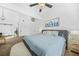 Bedroom with high ceilings, a large bed, carpeted floors, and a barn door to an adjacent room at 1995 Meador Ave, Atlanta, GA 30315
