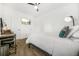 Simple bedroom with a ceiling fan, a bed with white bedding, and a desk with chair at 1995 Meador Ave, Atlanta, GA 30315
