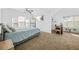 Bright primary bedroom with large windows, vaulted ceilings, and a spacious work area at 1995 Meador Ave, Atlanta, GA 30315