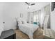 Bright bedroom with a ceiling fan, a bed with white bedding, and a desk in the corner at 1995 Meador Ave, Atlanta, GA 30315