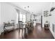 Dining room with hardwood floors, stylish lighting, and open access to the kitchen and living areas at 1995 Meador Ave, Atlanta, GA 30315