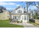 Charming two-story home featuring a cozy front porch, a well-manicured lawn, and a welcoming entrance at 1995 Meador Ave, Atlanta, GA 30315