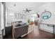Open-concept living room featuring hardwood floors, stylish furnishings, and ample natural light at 1995 Meador Ave, Atlanta, GA 30315