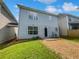 Back exterior view of the house and a well-maintained lawn, ready for outdoor activities at 509 Carlton Pointe Dr, Palmetto, GA 30268