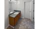 Clean bathroom featuring a single vanity and a large mirror and linoleum floors at 509 Carlton Pointe Dr, Palmetto, GA 30268
