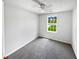 Bright bedroom with neutral carpet, large window providing natural light and green lawn view at 509 Carlton Pointe Dr, Palmetto, GA 30268