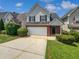 Charming two-story home with a brick and siding exterior, plus a manicured lawn at 509 Carlton Pointe Dr, Palmetto, GA 30268