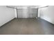 Spacious two-car garage with a concrete floor and an open garage door at 509 Carlton Pointe Dr, Palmetto, GA 30268