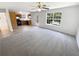 Open-concept living room flowing into the kitchen with abundant natural light at 509 Carlton Pointe Dr, Palmetto, GA 30268