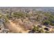 Expansive aerial view of a property backing onto a golf course and a lake surrounded by lush trees and other homes at 1585 Lake Dow Rd, Mcdonough, GA 30252